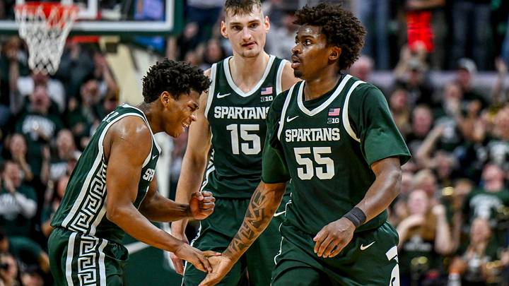 Michigan State's Jeremy Fears Jr., left, slaps hands with Coen Carr, right, after Carr's dunk against Northwestern during the second half on Thursday, Jan. 8, 2026, at the Breslin Center in East Lansing.