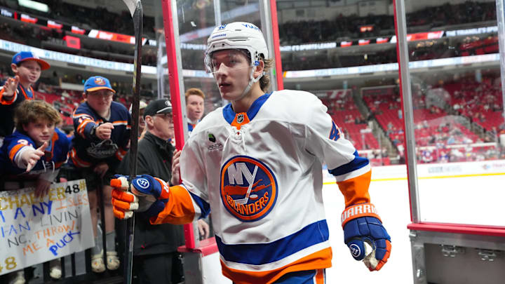 Oct 30, 2025; Raleigh, North Carolina, USA;  New York Islanders defenseman Matthew Schaefer (48) goes past the fans on his way off the ice after the warmups before the game against the Carolina Hurricanes at Lenovo Center. Mandatory Credit: James Guillory-Imagn Images
