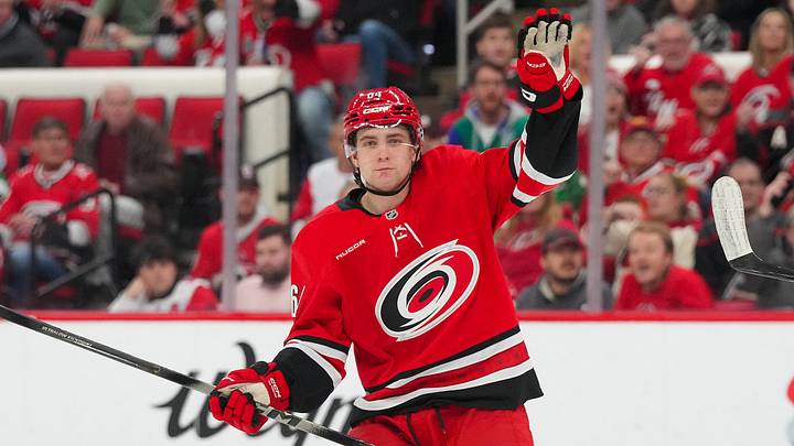 Jan 22, 2026; Raleigh, North Carolina, USA;  Carolina Hurricanes defenseman Joel Nystrom (64) celebrates his goal against the Chicago Blackhawks during the first period at Lenovo Center. Mandatory Credit: James Guillory-Imagn Images