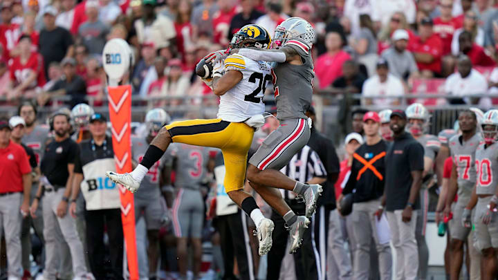 Oct 5, 2024; Columbus, OH, USA; Iowa Hawkeyes defensive back Sebastian Castro (29) makes an interception in front of Ohio State Buckeyes wide receiver Emeka Egbuka (2) in the second quarter during the NCAA football game at Ohio Stadium. Oct 5, 2024; Columbus, OH, USA; Iowa Hawkeyes defensive back Sebastian Castro (29) makes an interception in front of Ohio State Buckeyes wide receiver Emeka Egbuka (2) in the second quarter during the NCAA football game at Ohio Stadium.