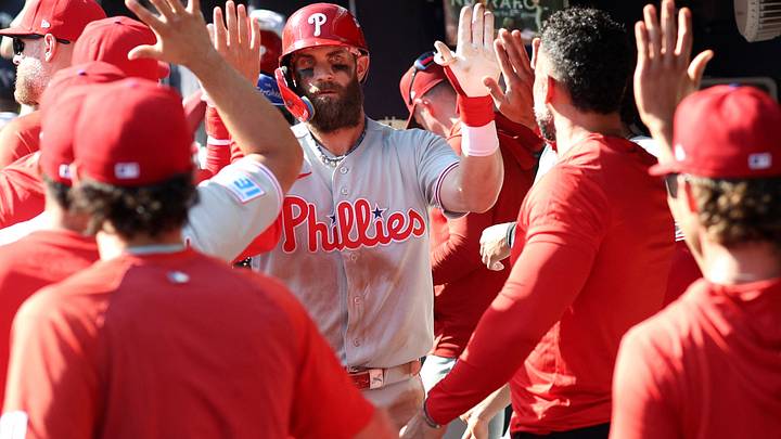 Sep 30, 2026; Cumberland, Georgia, USA; Philadelphia Phillies outfielder Bryce Harper (3) celebrates with teammates in the dugout after hitting a solo home run against the Atlanta Braves in the eighth inning during game two of the Wildcard round for the 2026 MLB Playoffs at Truist Park. Mandatory Credit: Brett Davis-Imagn Images Sep 30, 2026; Cumberland, Georgia, USA; Philadelphia Phillies outfielder Bryce Harper (3) celebrates with teammates in the dugout after hitting a solo home run against the Atlanta Braves in the eighth inning during game two of the Wildcard round for the 2026 MLB Playoffs at Truist Park. Mandatory Credit: Brett Davis-Imagn Images
