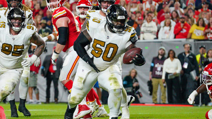 Oct 7, 2024; Kansas City, Missouri, USA; New Orleans Saints defensive tackle Khalen Saunders (50) intercepts a pass intended for Kansas City Chiefs wide receiver JuJu Smith-Schuster (9) (not pictured) during the second half at GEHA Field at Arrowhead Stadium. Mandatory Credit: Denny Medley-Imagn Images