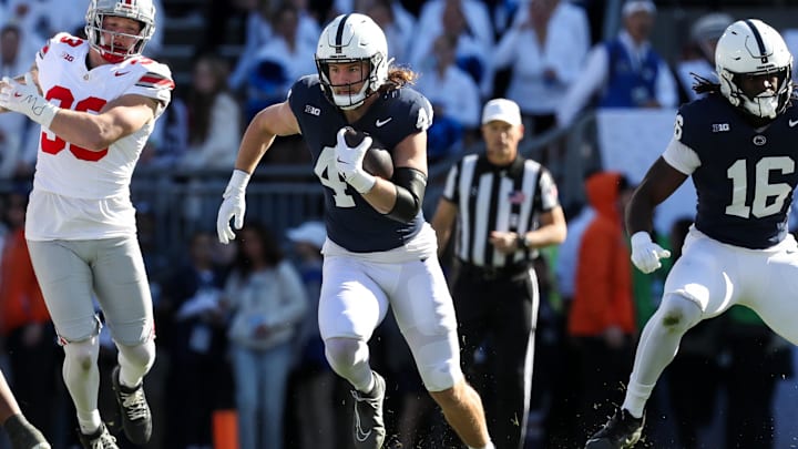 Nov 2, 2024; University Park, Pennsylvania, USA; Penn State Nittany Lions tight end Tyler Warren (44) runs with the ball during the first quarter against the Ohio State Buckeyes at Beaver Stadium. Mandatory Credit: Matthew O'Haren-Imagn Images