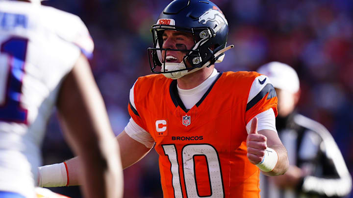 Jan 17, 2026; Denver, CO, USA; Denver Broncos quarterback Bo Nix (10) calls an audible during the first quarter of an AFC Divisional Round playoff game against the Buffalo Bills at Empower Field at Mile High. Mandatory Credit: Ron Chenoy-Imagn Images