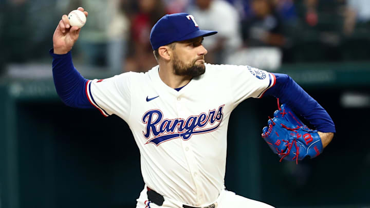 Aug 5, 2025; Arlington, Texas, USA;  Texas Rangers starting pitcher Nathan Eovaldi (17) throws during the first inning against the New York Yankees at Globe Life Field.