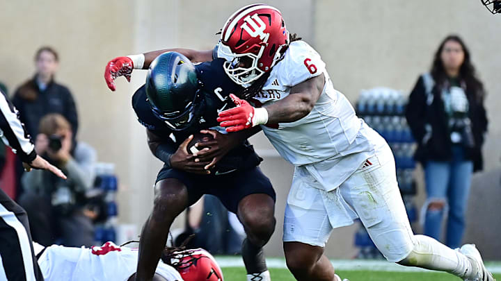 Michigan State Spartans quarterback Aidan Chiles (2) gets sacked by Indiana Hoosiers defensive lineman Mikail Kamara (6) during the second quarter at Spartan Stadium.