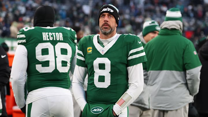 Jan 5, 2025; East Rutherford, New Jersey, USA; New York Jets quarterback Aaron Rodgers (8) looks on during the first quarter of their game against the Miami Dolphins at MetLife Stadium. Mandatory Credit: Ed Mulholland-Imagn Images