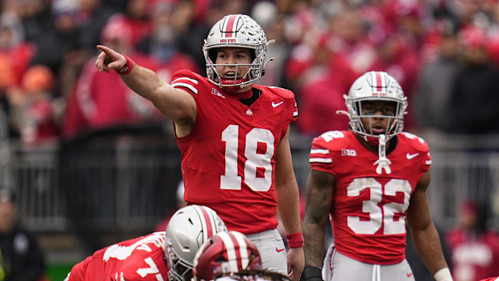 Ohio State Buckeyes quarterback Will Howard (18) signals to his offense during the second half of the NCAA football game against the Indiana Hoosiers at Ohio Stadium in Columbus on Saturday, Nov. 23, 2024. Ohio State won 38-15.