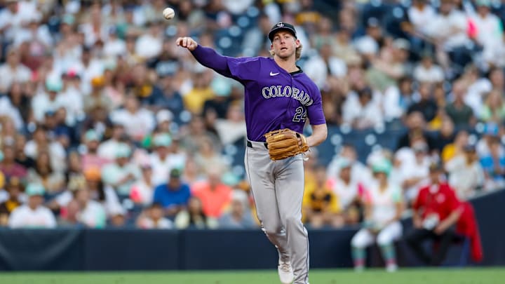 Aug 2, 2024; San Diego, California, USA; Colorado Rockies third baseman Ryan McMahon (24) makes a throw to first base for an out during the first inning against the San Diego Padres at Petco Park. Aug 2, 2024; San Diego, California, USA; Colorado Rockies third baseman Ryan McMahon (24) makes a throw to first base for an out during the first inning against the San Diego Padres at Petco Park.