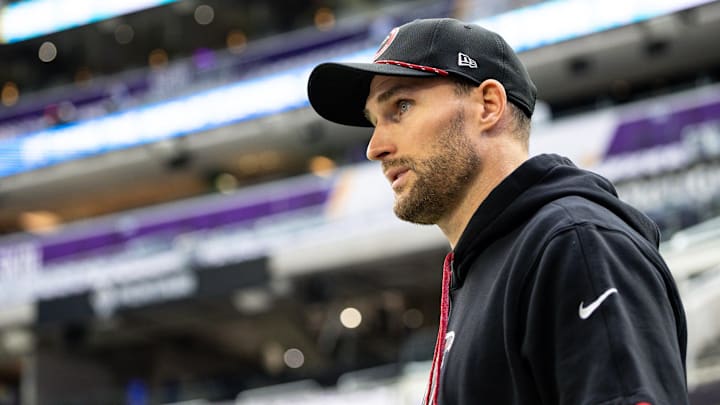 Atlanta Falcons quarterback Cousins walks onto the field before a game against the Minnesota Vikings at U.S. Bank Stadium.
