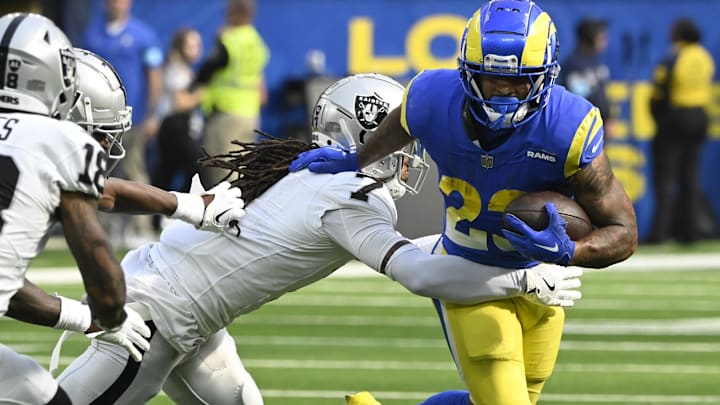 Oct 20, 2024; Inglewood, California, USA; Los Angeles Rams running back Kyren Williams (23) tries to break a tackle by Las Vegas Raiders safety Tre'von Moehrig (7) during the third quarter at SoFi Stadium. Mandatory Credit: Robert Hanashiro-Imagn Images Oct 20, 2024; Inglewood, California, USA; Los Angeles Rams running back Kyren Williams (23) tries to break a tackle by Las Vegas Raiders safety Tre'von Moehrig (7) during the third quarter at SoFi Stadium. Mandatory Credit: Robert Hanashiro-Imagn Images