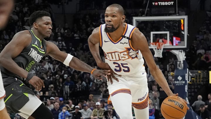 Mar 28, 2025; Minneapolis, Minnesota, USA; Phoenix Suns forward Kevin Durant (35) brings the ball up