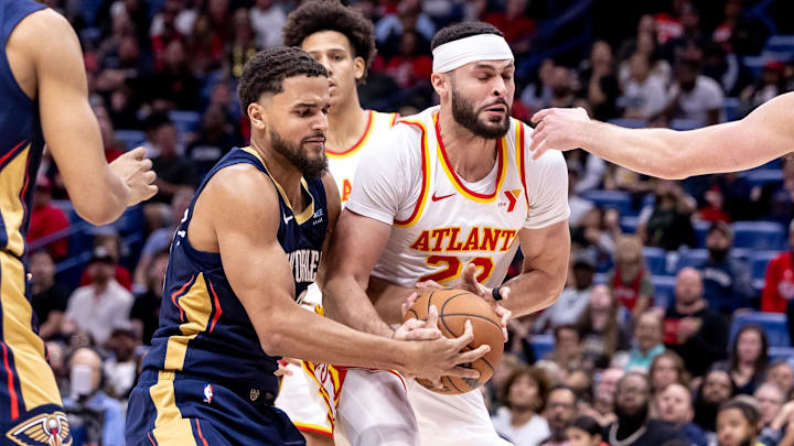 Nov 3, 2024; New Orleans, Louisiana, USA;  Atlanta Hawks forward Larry Nance Jr. (22) and New Orleans Pelicans forward Jeremiah Robinson-Earl (50)  fights for position during the second half at Smoothie King Center.