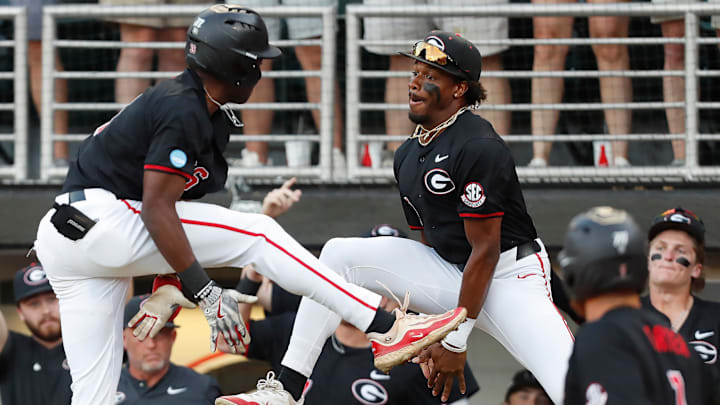 Georgia's Corey Collins (6) celebrates with teammate Josh Stinson after hitting a home run during Game 3 of the Super NCAA Regional against NC State at Foley Field on Monday, June 10, 2024 in Athens, Ga. NC State won 8-5.