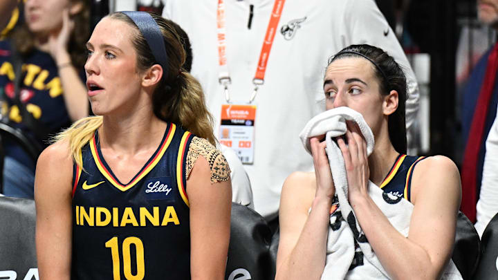 Sep 22, 2024; Uncasville, Connecticut, USA; Indiana Fever guard Lexie Hull (10) and Indiana Fever guard Caitlin Clark (22) watch from the bench in the fourth quarter during game one of the first round of the 2024 WNBA Playoffs at Mohegan Sun Arena. Mandatory Credit: Mark Smith-Imagn Images Sep 22, 2024; Uncasville, Connecticut, USA; Indiana Fever guard Lexie Hull (10) and Indiana Fever guard Caitlin Clark (22) watch from the bench in the fourth quarter during game one of the first round of the 2024 WNBA Playoffs at Mohegan Sun Arena. Mandatory Credit: Mark Smith-Imagn Images