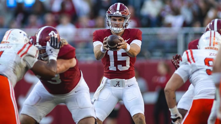 Nov 16, 2024; Tuscaloosa, Alabama, USA; Alabama Crimson Tide quarterback Ty Simpson (15) receives a snapped ball against the Mercer Bears during the third quarter at Bryant-Denny Stadium. Mandatory Credit: Will McLelland-Imagn Images