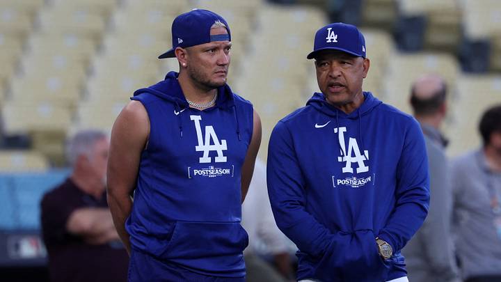 Oct 12, 2024; Los Angeles, CA, USA; Los Angeles Dodgers manager Dave Roberts (right) speaks to shortstop Miguel Rojas (left) during the NLCS workouts at Dodgers Stadium. Mandatory Credit: Kiyoshi Mio-Imagn Images Oct 12, 2024; Los Angeles, CA, USA; Los Angeles Dodgers manager Dave Roberts (right) speaks to shortstop Miguel Rojas (left) during the NLCS workouts at Dodgers Stadium. Mandatory Credit: Kiyoshi Mio-Imagn Images