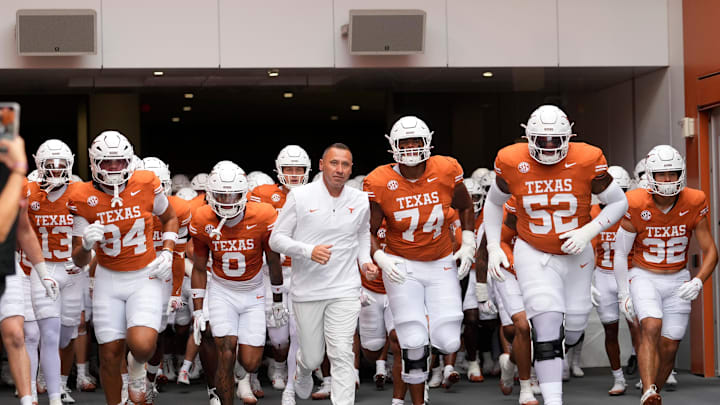 Texas Longhorns head coach Steve Sarkisian leads his team on to the field before a game against the Sam Houston State Bearkats.
