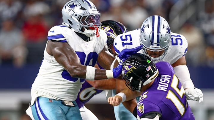 Dallas Cowboys defensive linemen Earnest Brown IV and Perrion Winfrey pressure Baltimore Ravens quarterback Cooper Rush 