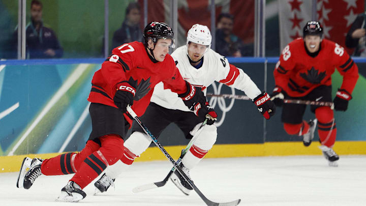 Feb 13, 2026; Milan, Italy; Macklin Celebrini of Canada in action with Pius Suter of Switzerland in men's ice hockey group A play during the Milano Cortina 2026 Olympic Winter Games at Milano Santagiulia Ice Hockey Arena. Mandatory Credit: Geoff Burke-Imagn Images Feb 13, 2026; Milan, Italy; Macklin Celebrini of Canada in action with Pius Suter of Switzerland in men's ice hockey group A play during the Milano Cortina 2026 Olympic Winter Games at Milano Santagiulia Ice Hockey Arena. Mandatory Credit: Geoff Burke-Imagn Images