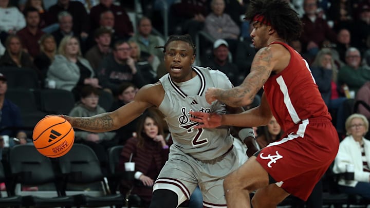 Mississippi State Bulldogs guard Ja’Borri McGhee (2) dribbles as Alabama Crimson Tide forward Amari Allen (5) defends during the first half at Humphrey Coliseum.