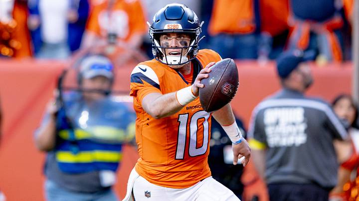 DENVER, CO - OCTOBER 19: Bo Nix scores a touchdown vs. the New York Giants. DENVER, CO - OCTOBER 19: Bo Nix scores a touchdown vs. the New York Giants.
