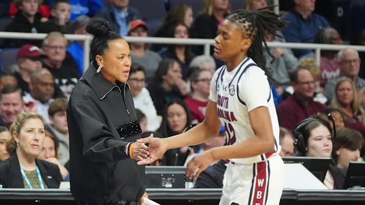 Mar 31, 2024; Albany, NY, USA; South Carolina Gamecocks head coach Dawn Staley slaps hands with South Carolina Gamecocks guard MiLaysia Fulwiley (12) as she comes off the court during the first half against the Oregon State Beavers in the finals of the Albany Regional of the 2024 NCAA Tournament at MVP Arena. Mandatory Credit: Gregory Fisher-Imagn Images