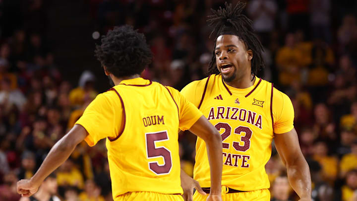 Jan 24, 2026; Tempe, Arizona, USA; Arizona State Sun Devils forward Allen Mukeba (23) celebrates with guard Maurice Odum (5) against the Cincinnati Bearcats in the first half at Desert Financial Arena. Mandatory Credit: Mark J. Rebilas-Imagn Images