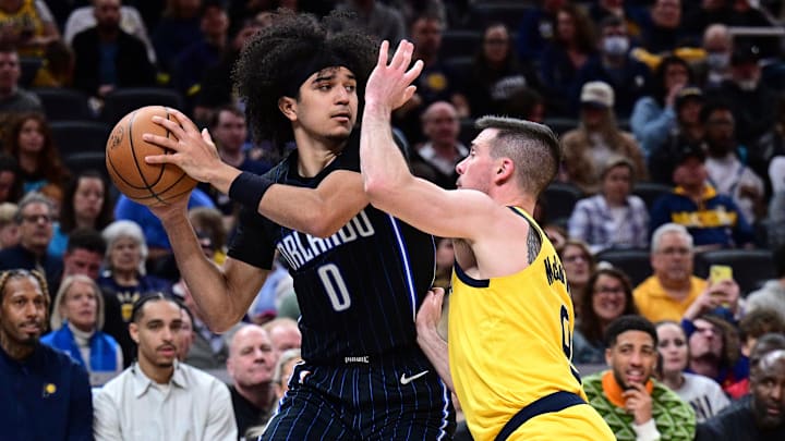 Orlando Magic guard Anthony Black (0) looks to get a ball past Indiana Pacers guard T.J. McConnell (9) during the second half at Gainbridge Fieldhouse. 