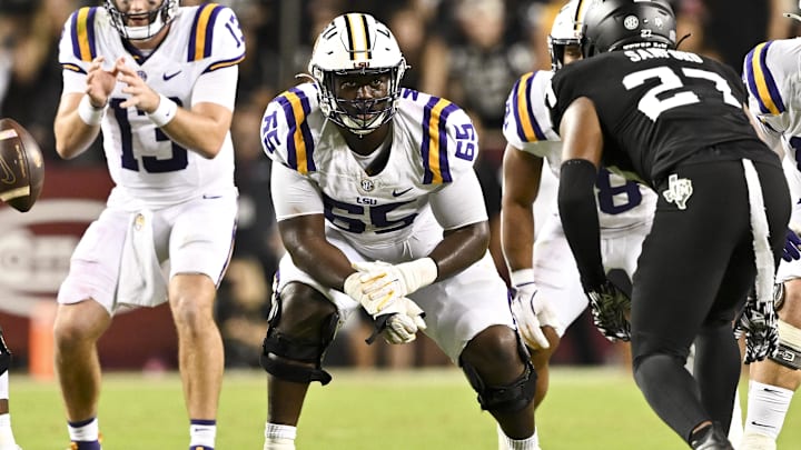Oct 26, 2024; College Station, Texas, USA; LSU Tigers offensive lineman Paul Mubenga (65) lines up during the second half against the Texas A&M Aggies. The Aggies defeated the Tigers 38-23; at Kyle Field. Mandatory Credit: Maria Lysaker-Imagn Images.  