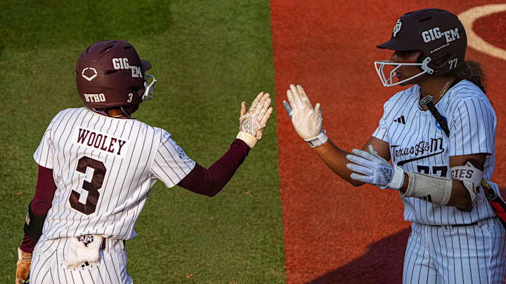 Texas A&M infielder Koko Wooley (3) high fives outfielder Jazmine Hill (77) after a score during the game three NCAA Super Regional against the Texas Longhorns at Red & Charline McCombs Field on Sunday, May 26, 2024 in Austin. Texas A&M infielder Koko Wooley (3) high fives outfielder Jazmine Hill (77) after a score during the game three NCAA Super Regional against the Texas Longhorns at Red & Charline McCombs Field on Sunday, May 26, 2024 in Austin.