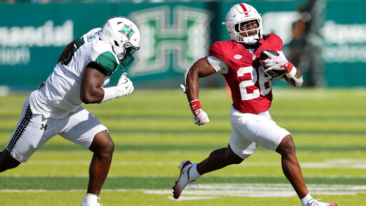 Aug 23, 2025; Honolulu, Hawaii, USA;  Hawaii Rainbow Warriors defensive lineman Tariq Jones (5) tries to chases down Stanford Cardinal running back Sedrick Irvin (26) during the second half at Clarence T.C. Ching Athletics Complex. Mandatory Credit: Marco Garcia-Imagn Images