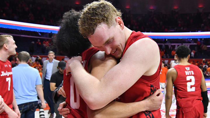 Feb 10, 2026; Champaign, Illinois, USA; Wisconsin Badgers players celebrated a win over the Illinois Fighting Illini at State Farm Center.