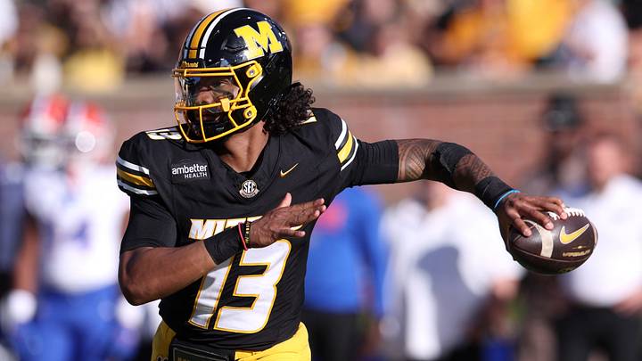 Oct 3, 2026; Columbia, Missouri, USA; Missouri Tigers quarterback Austin Simmons (13) looks to throw in the third quarter against the Florida Gators at Faurot Field at Memorial Stadium. Mandatory Credit: William Purnell-Imagn Images Oct 3, 2026; Columbia, Missouri, USA; Missouri Tigers quarterback Austin Simmons (13) looks to throw in the third quarter against the Florida Gators at Faurot Field at Memorial Stadium. Mandatory Credit: William Purnell-Imagn Images