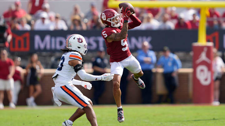 Oklahoma receiver Isaiah Sategna hauls in a pass against Auburn. Oklahoma receiver Isaiah Sategna hauls in a pass against Auburn.