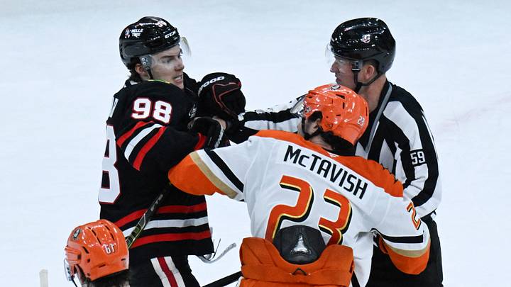 Nov 30, 2025; Chicago, Illinois, USA; Anaheim Ducks center Mason McTavish (23) swings at Chicago Blackhawks left wing Andre Burakovsky (28) at the end of the third period at United Center. Mandatory Credit: Matt Marton-Imagn Images Nov 30, 2025; Chicago, Illinois, USA; Anaheim Ducks center Mason McTavish (23) swings at Chicago Blackhawks left wing Andre Burakovsky (28) at the end of the third period at United Center. Mandatory Credit: Matt Marton-Imagn Images