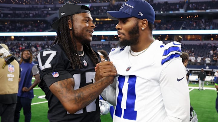 Las Vegas Raiders wide receiver Davante Adams greets Dallas Cowboys star Micah Parsons after a game at AT&T Stadium. 