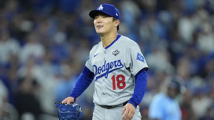 Los Angeles Dodgers pitcher Yoshinobu Yamamoto (18) reacts in the sixth inning against the Toronto Blue Jays during game six of the 2025 MLB World Series at Rogers Centre. 