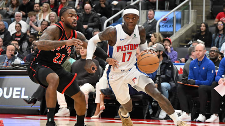 Apr 4, 2025; Toronto, Ontario, CAN;  Detroit Pistons guard Dennis Schroder (17) dribbles the ball past Toronto Raptors guard Jamal Shead (23) in the first half at Scotiabank Arena. Mandatory Credit: Dan Hamilton-Imagn Images