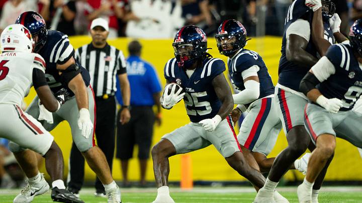 Sep 6, 2026; Nashville, Tennessee, USA;  Ole Miss Rebels running back Makhi Frazier (25) runs with the ball against the Louisville Cardinals during the second half at Nissan Stadium. Mandatory Credit: Steve Roberts-Imagn Images