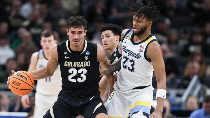 Mar 24, 2024; Indianapolis, IN, USA; Colorado Buffaloes forward Tristan da Silva (23) dribbles against Marquette Golden Eagles forward David Joplin (23) during the first half at Gainbridge FieldHouse. Mandatory Credit: Trevor Ruszkowski-USA TODAY Sports