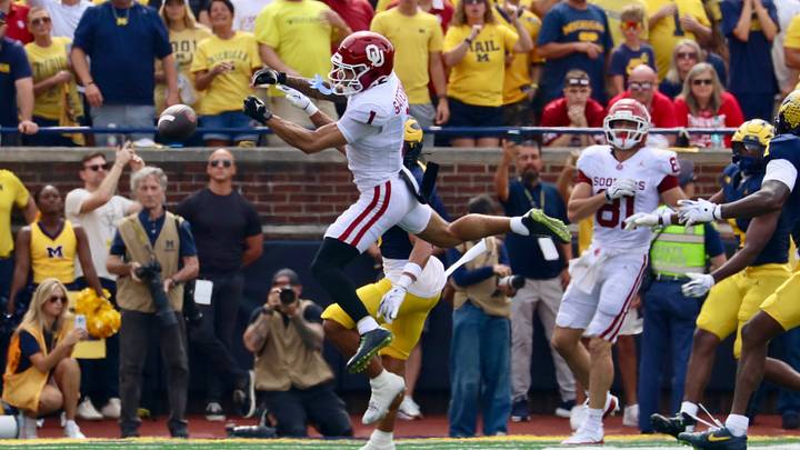 Oklahoma receiver Isaiah Sategna is unable to haul in a pass from John Mateer in the first half against the Michigan Wolverines. Oklahoma receiver Isaiah Sategna is unable to haul in a pass from John Mateer in the first half against the Michigan Wolverines.