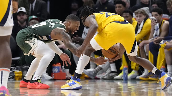 Apr 25, 2025; Milwaukee, Wisconsin, USA; Indiana Pacers forward Aaron Nesmith (23) and Milwaukee Bucks guard Damian Lillard (0) square off against each other in the second half during game three of first round for the 2024 NBA Playoffs at Fiserv Forum. Mandatory Credit: Michael McLoone-Imagn Images Apr 25, 2025; Milwaukee, Wisconsin, USA; Indiana Pacers forward Aaron Nesmith (23) and Milwaukee Bucks guard Damian Lillard (0) square off against each other in the second half during game three of first round for the 2024 NBA Playoffs at Fiserv Forum. Mandatory Credit: Michael McLoone-Imagn Images