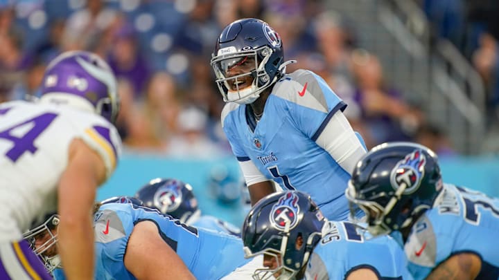 Tennessee Titans quarterback Cam Ward (1) gets into position for the first play of the pre-season game against the Minnesota Vikings at Nissan Stadium in Nashville, Tenn., Friday, Aug. 22, 2025.