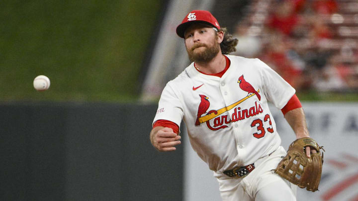 Aug 11, 2025; St. Louis, Missouri, USA; St. Louis Cardinals second baseman Brendan Donovan (33) flips the ball to first base during the ninth inning against the Colorado Rockies at Busch Stadium. Mandatory Credit: Jeff Curry-Imagn Images Aug 11, 2025; St. Louis, Missouri, USA; St. Louis Cardinals second baseman Brendan Donovan (33) flips the ball to first base during the ninth inning against the Colorado Rockies at Busch Stadium. Mandatory Credit: Jeff Curry-Imagn Images