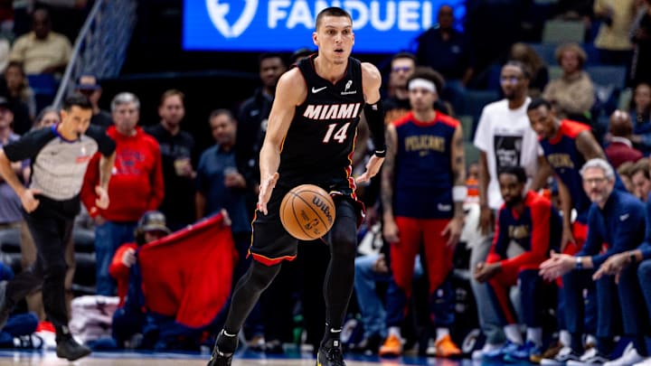 Apr 11, 2025; New Orleans, Louisiana, USA;  Miami Heat guard Tyler Herro (14) brings the ball up court against the New Orleans Pelicans during the first half at Smoothie King Center. Mandatory Credit: Stephen Lew-Imagn Images