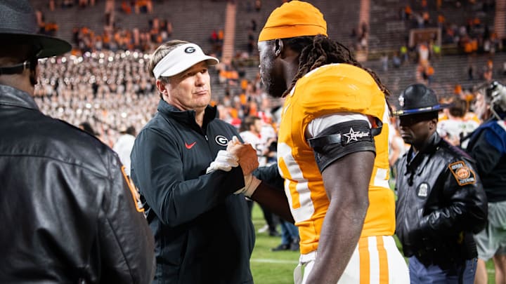 Georgia head coach Kirby Smart talks with Tennessee defensive lineman Roman Harrison (30) after a football game between Tennessee and Georgia at Neyland Stadium in Knoxville, Tenn., on Saturday, Nov. 18, 2023.