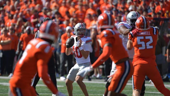Oct 11, 2025; Champaign, Illinois, USA; Ohio State Buckeyes quarterback Julian Sayin (10) throws downfield during the first quarter against the Illinois Fighting Illini at Memorial Stadium. Mandatory Credit: Ron Johnson-Imagn Images