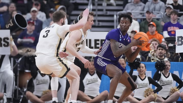 Mar 20, 2025; Providence, RI, USA; High Point Panthers forward Terry Anderson (0) controls the ball against Purdue Boilermakers guard Braden Smith (3) and guard Fletcher Loyer (2) during the first half at Amica Mutual Pavilion. Mandatory Credit: Gregory Fisher-Imagn Images Mar 20, 2025; Providence, RI, USA; High Point Panthers forward Terry Anderson (0) controls the ball against Purdue Boilermakers guard Braden Smith (3) and guard Fletcher Loyer (2) during the first half at Amica Mutual Pavilion. Mandatory Credit: Gregory Fisher-Imagn Images