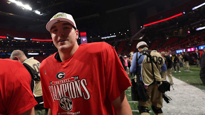Dec 7, 2024; Atlanta, GA, USA; Georgia Bulldogs quarterback Gunner Stockton (14) reacts after defeating the Texas Longhorns in overtime in the 2024 SEC Championship game at Mercedes-Benz Stadium. Mandatory Credit: Brett Davis-Imagn Images
